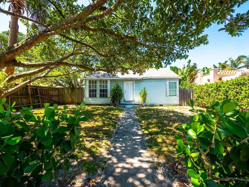 335 Greymon Dr as acquired — the original worn cottage